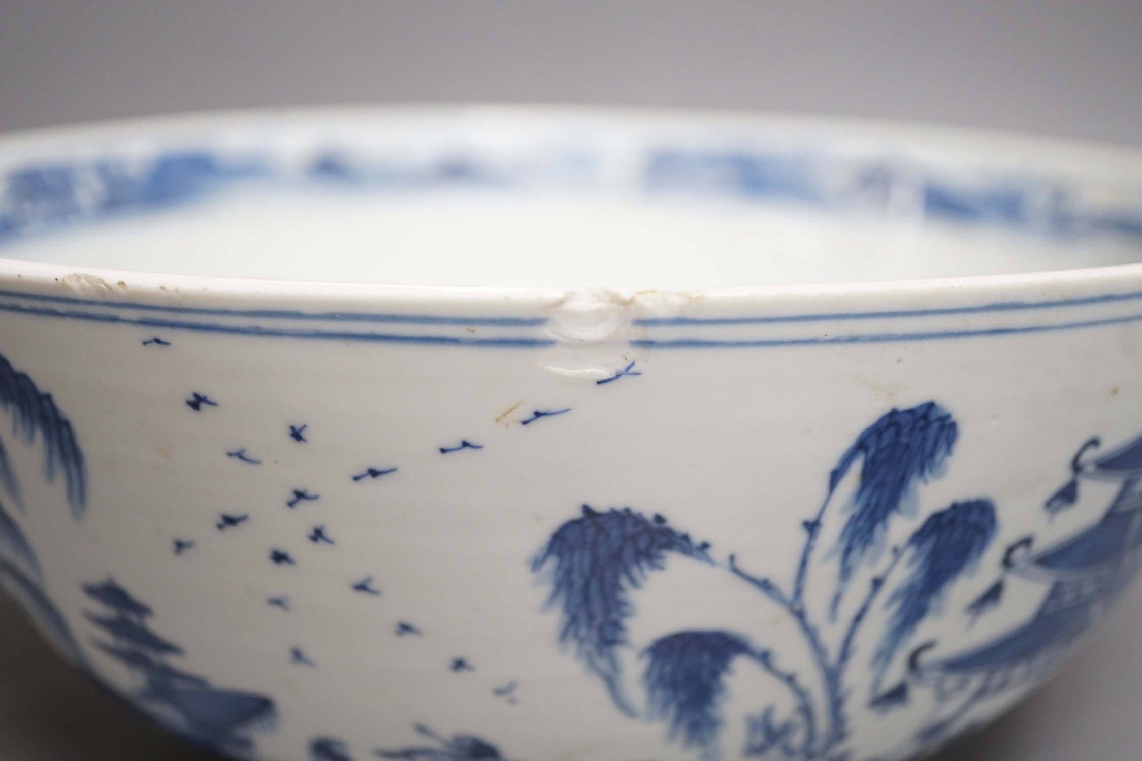 A 19th century Chinese blue and white landscape bowl, 26cm